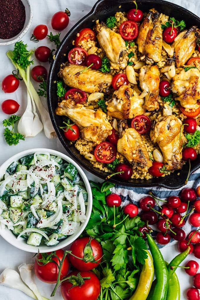 Pan fried chicken wings with bulgur served in one pan