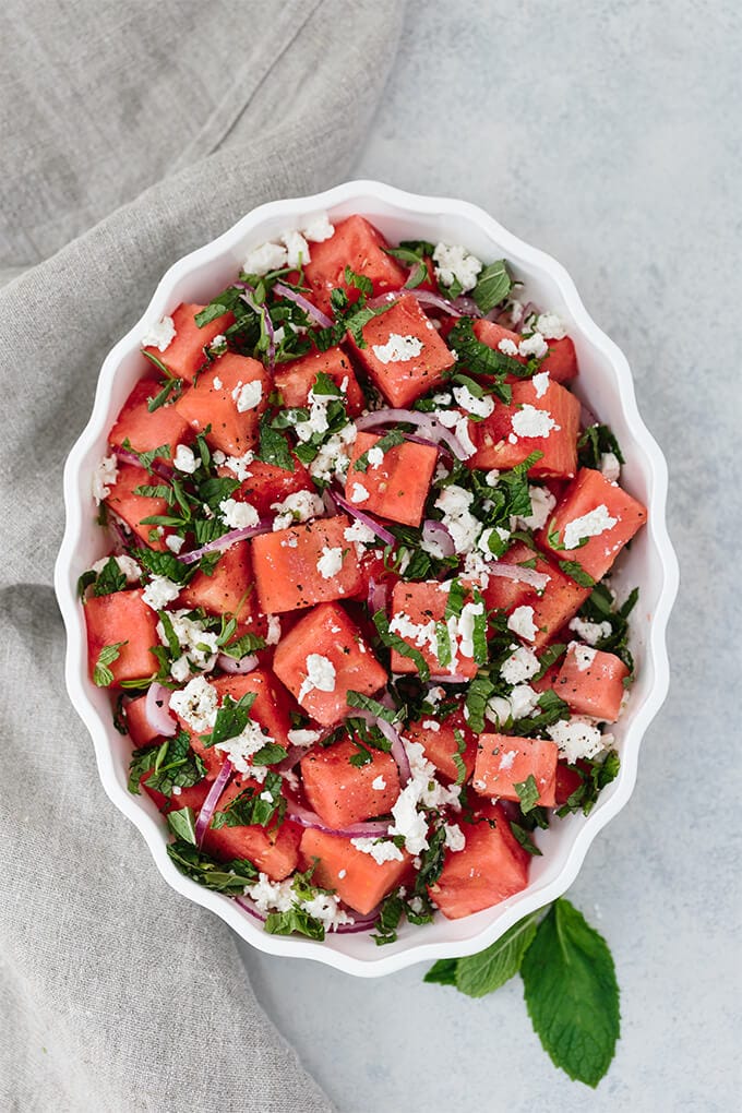 Watermelon Feta Mint Salad with red onion is a super refreshing summertime recipe. The simple balsamic dressing in this unexpected combination of flavors takes the salad to the next level. #ad #WFDRecipes