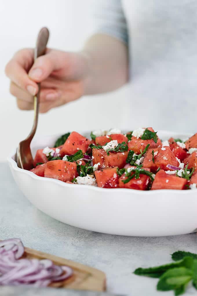 Watermelon Feta Mint Salad with red onion is a super refreshing summertime recipe. The simple balsamic dressing in this unexpected combination of flavors takes the salad to the next level. #ad #WFDRecipes