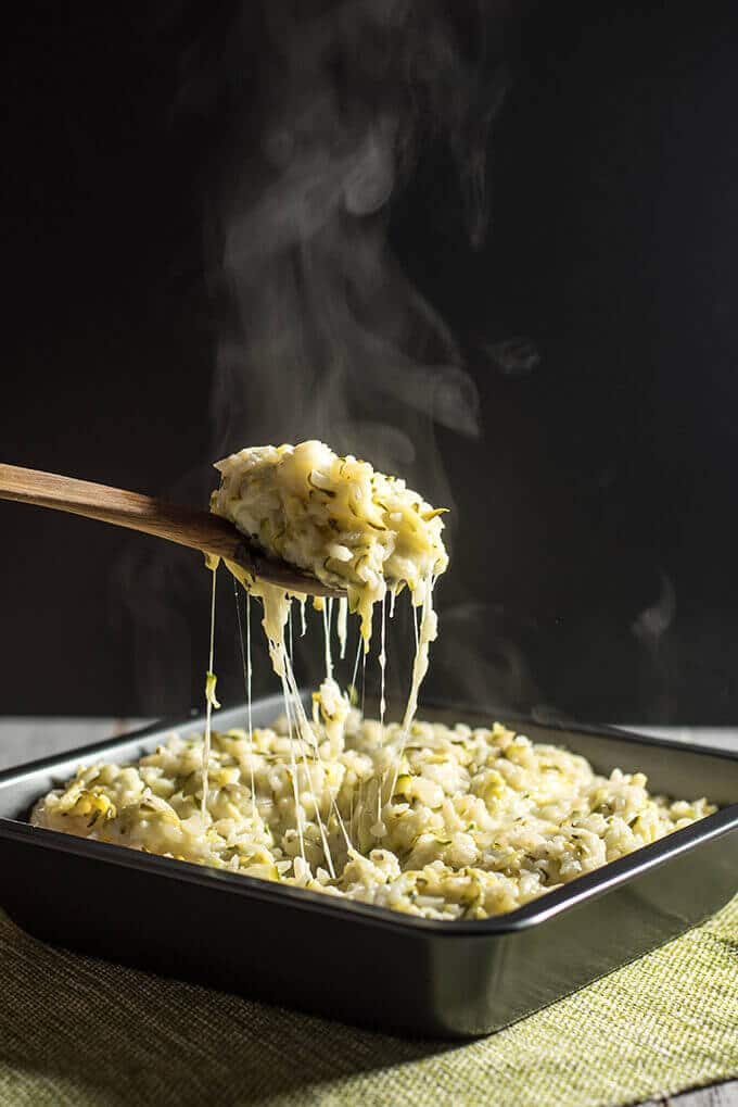 A great list of gluten free zucchini recipes from dinners to appetizers. These are so good that you don't need to follow a gf diet to make them. #zucchinirecipes #zucchini #glutenfree Serving hot cheesy zucchini rice casserole