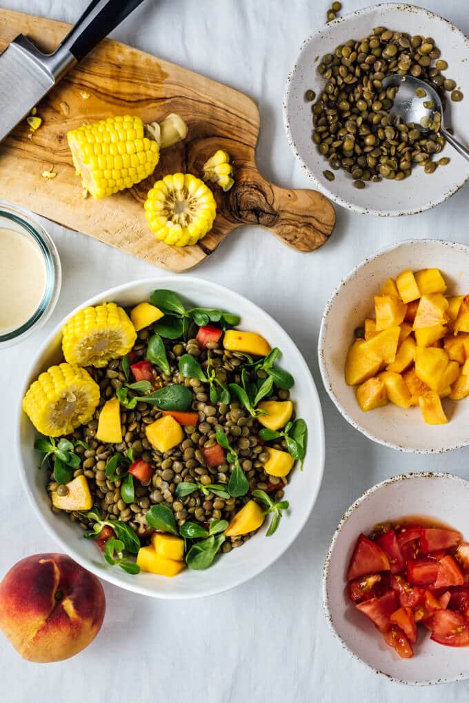 Cold Lentil Salad with Peaches is a refreshing and nutrition-packed summer meal. Tangy tahini dressing makes all the difference.