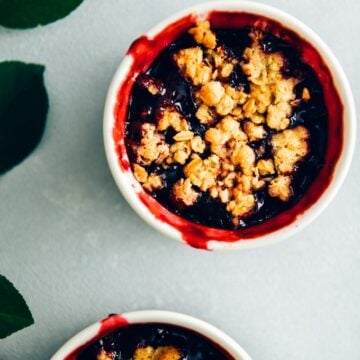 Fresh cherry crisp in white ramekins