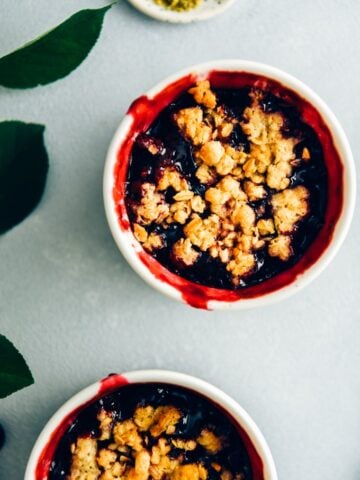 Fresh cherry crisp in white ramekins