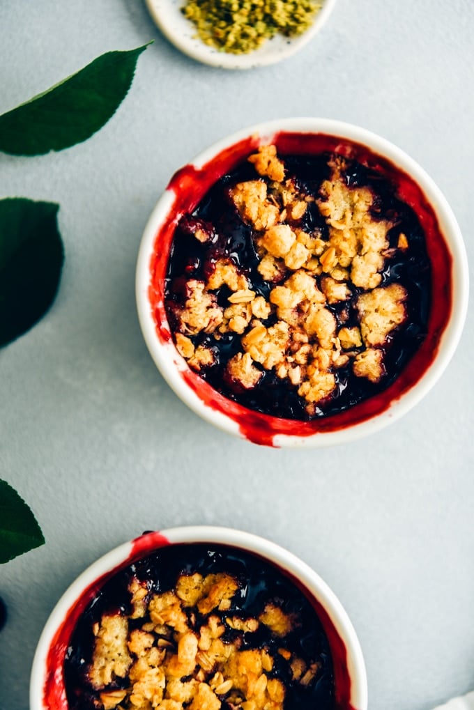 Fresh cherry crisp in white ramekins