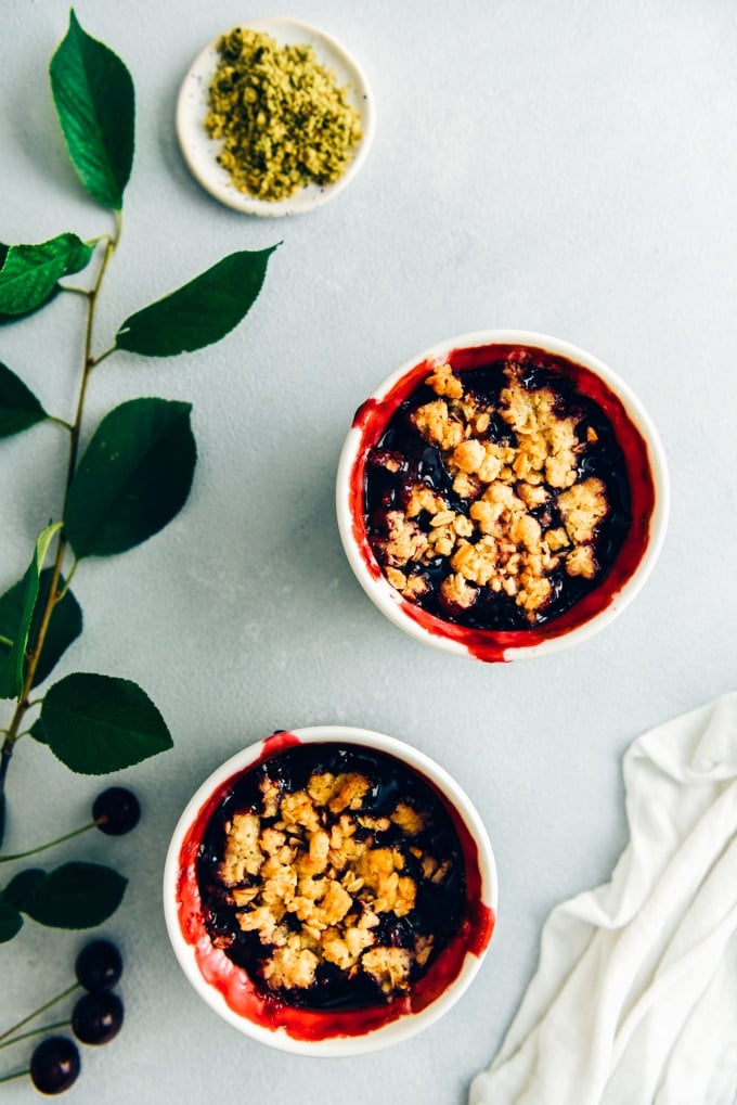 Fresh cherry crisp in white ramekins