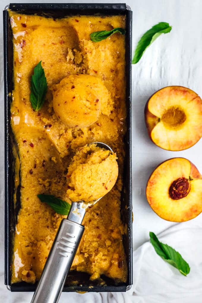 Peach Sorbet is the best thing to use up ripe peaches in your fridge. You can make this easy, sweet and refreshing sorbet with 5 ingredients without an ice cream maker.