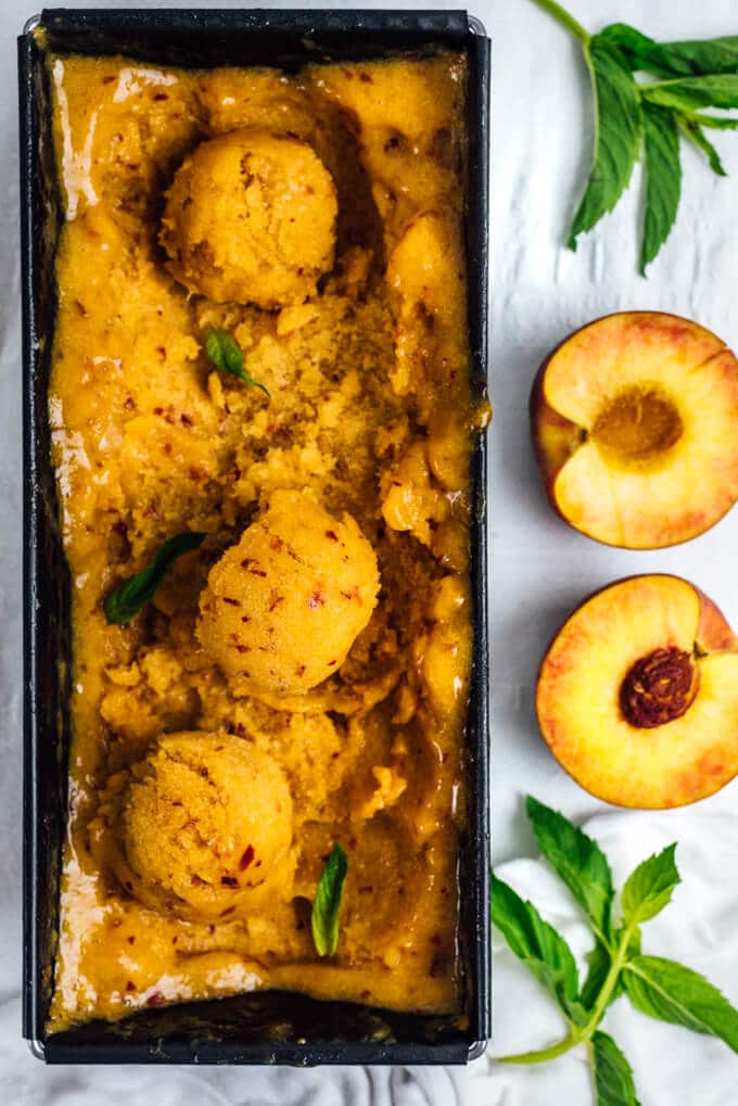 Peach Sorbet is the best thing to use up ripe peaches in your fridge. You can make this easy, sweet and refreshing sorbet with 5 ingredients without an ice cream maker.