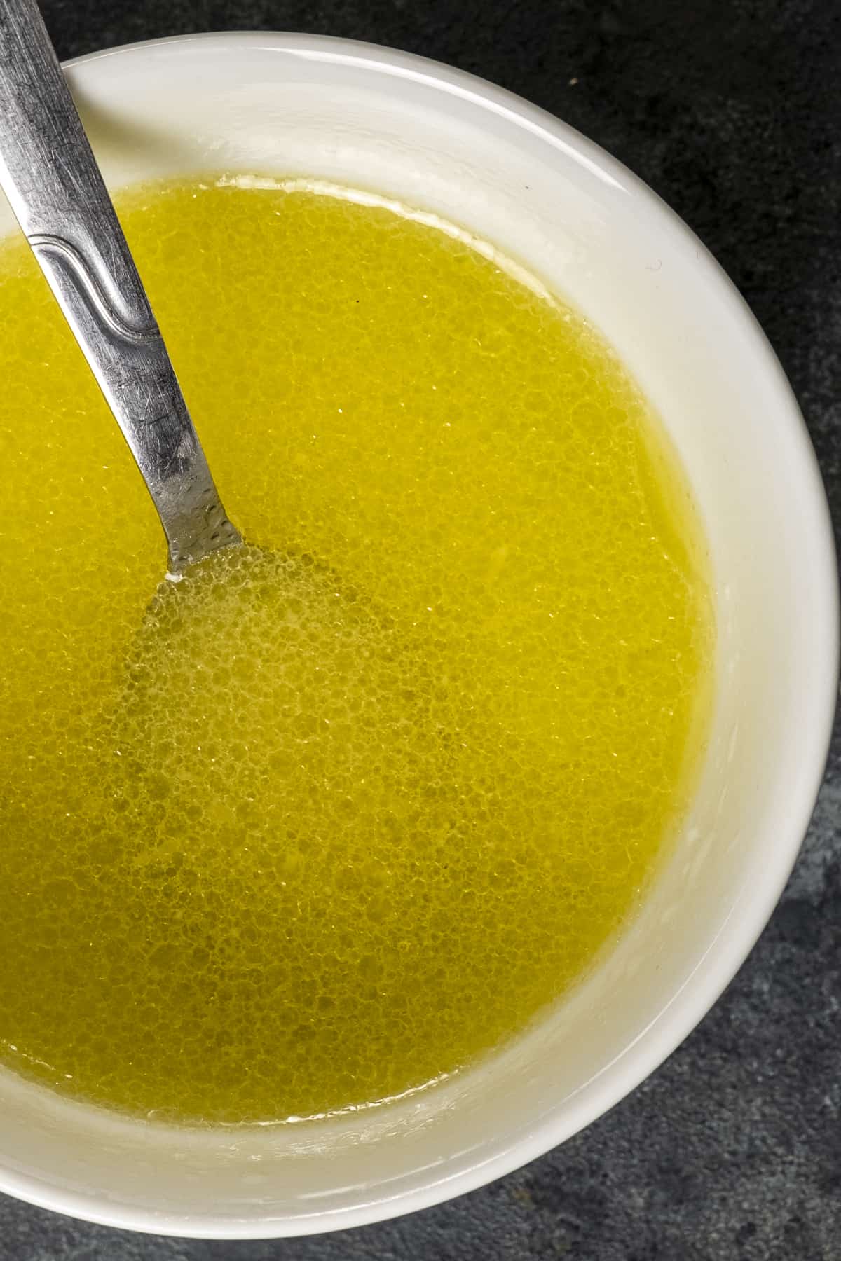 Lemon dressing in a white bowl.