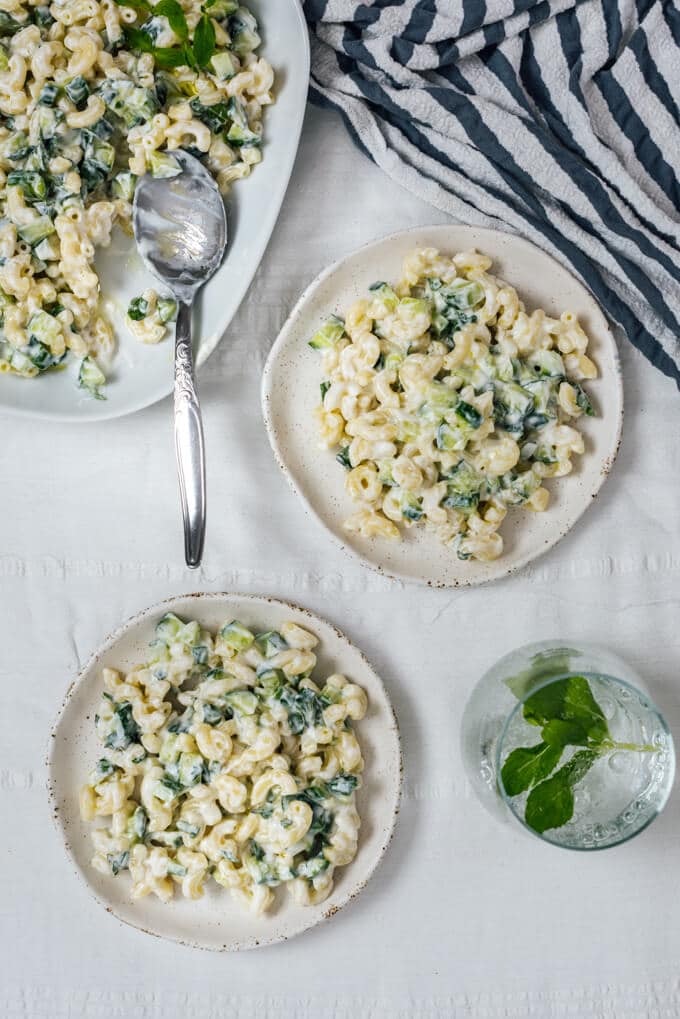 This Pasta Salad without Mayo is creamy and refreshing thanks to Greek yogurt and cucumber. Perfect summer lunch that is ready within minutes. #pastasalad #nomayo #yogurtpastasalad #pastarecipe Kid friendly pasta salad without mayo served on ceramic plates