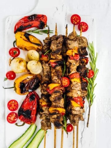 This Lamb Shish Kabob Recipe is a big hit on special occasions. The kabob is tender and juicy thanks to an easy yogurt marinade. Fancy yet simple and easy! Perfect for weeknight dinners too!  