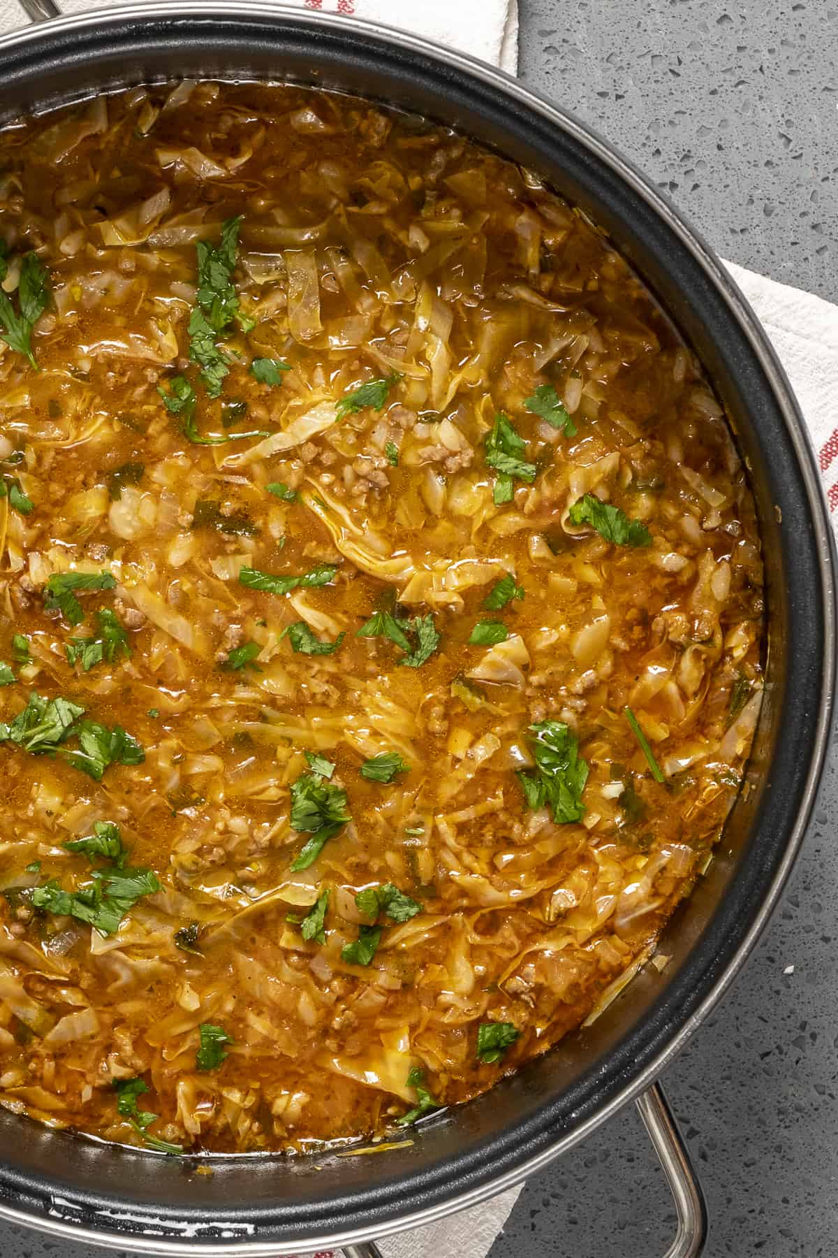 Cabbage soup with ground beef and rice in a pot.