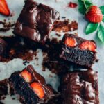 Chocolate strawberry brownies topped with a rich chocolate sauce