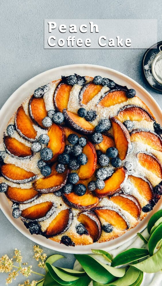 This Blueberry Peach Coffee Cake is a luscious cake that is sure to be a crowd pleaser. Made with olive oil and kefir, this simple cake is moist, tender and so light. #peachcake #peachcoffeecake #peachrecipe #coffeecake #kefircake #kefirrecipes