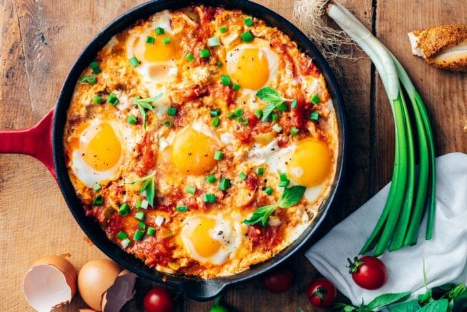 Turkish menemen served in an iron skillet