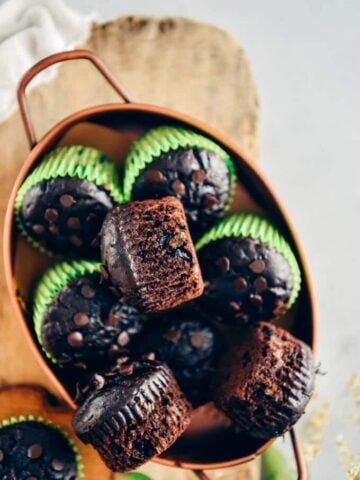 Healthy chocolate zucchini muffins in a copper pan.