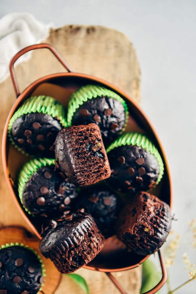 Healthy chocolate zucchini muffins in a copper pan.