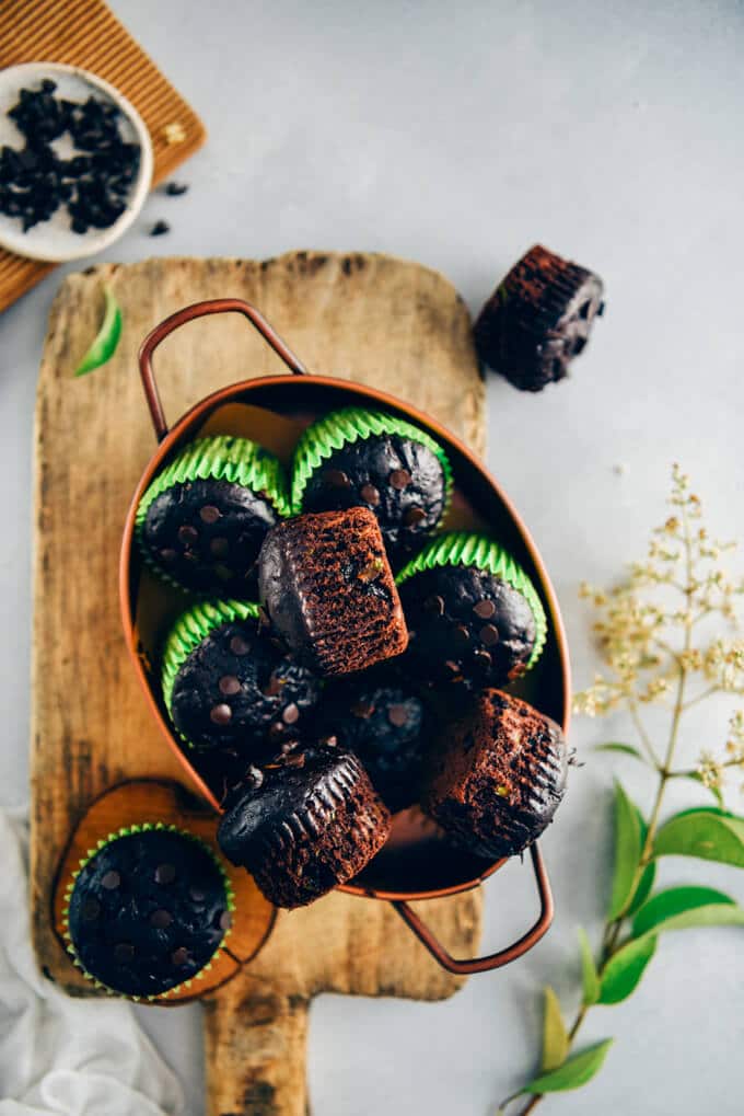 Healthy chocolate zucchini muffins in a copper pan 