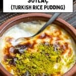Baked sütlaç with caramelized top and pistachios, served in a clay bowl with a spoon.