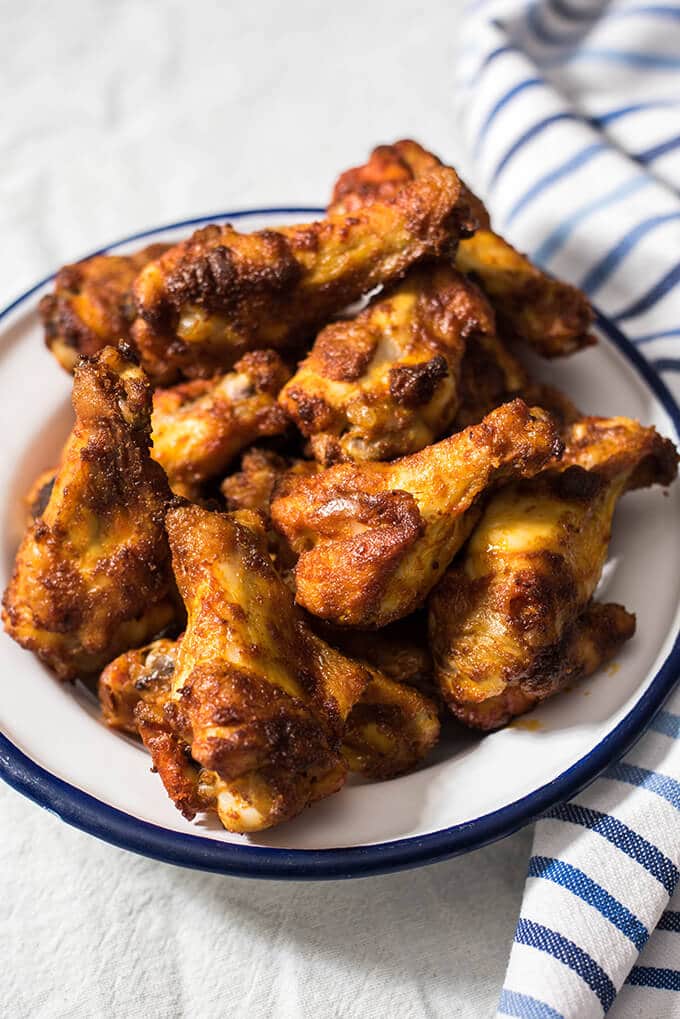 Crispy buffalo wings baked in oven served as game day finger foods