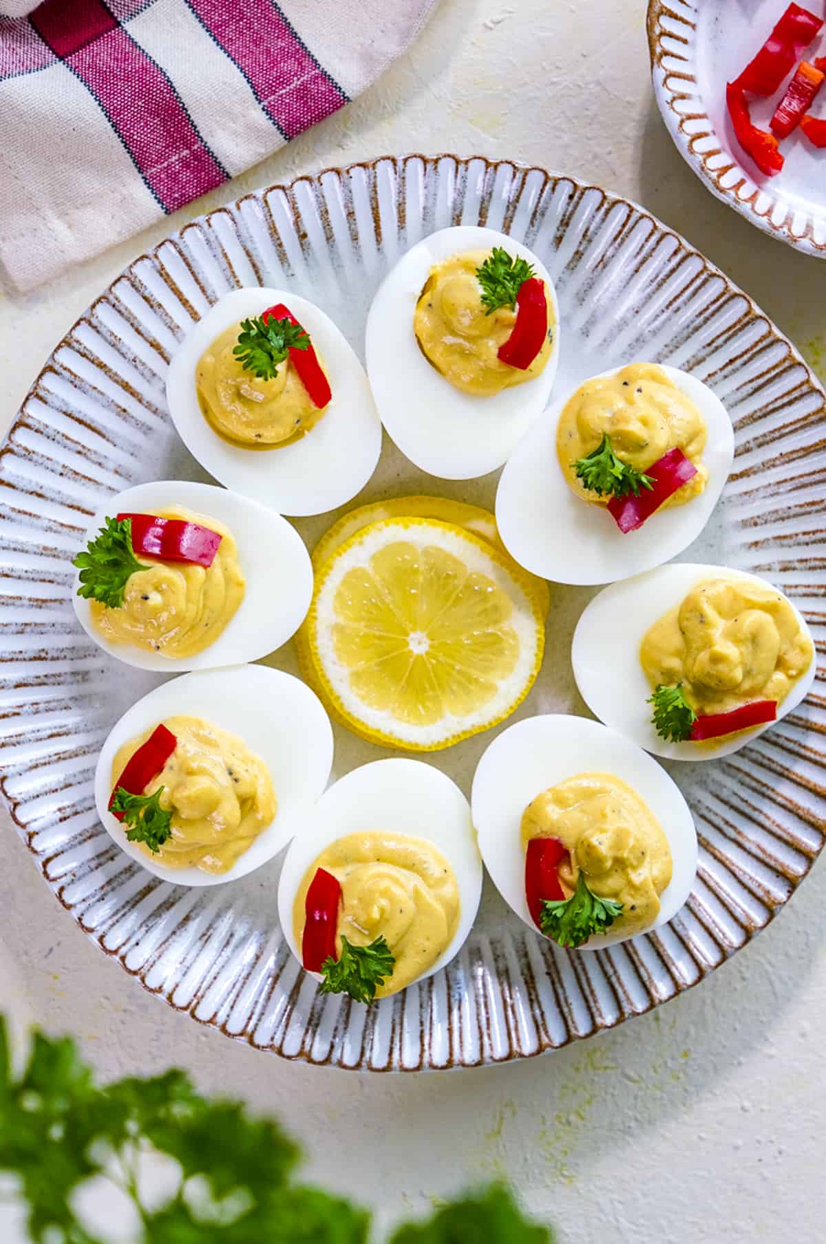 Deviled eggs served on a white plate.