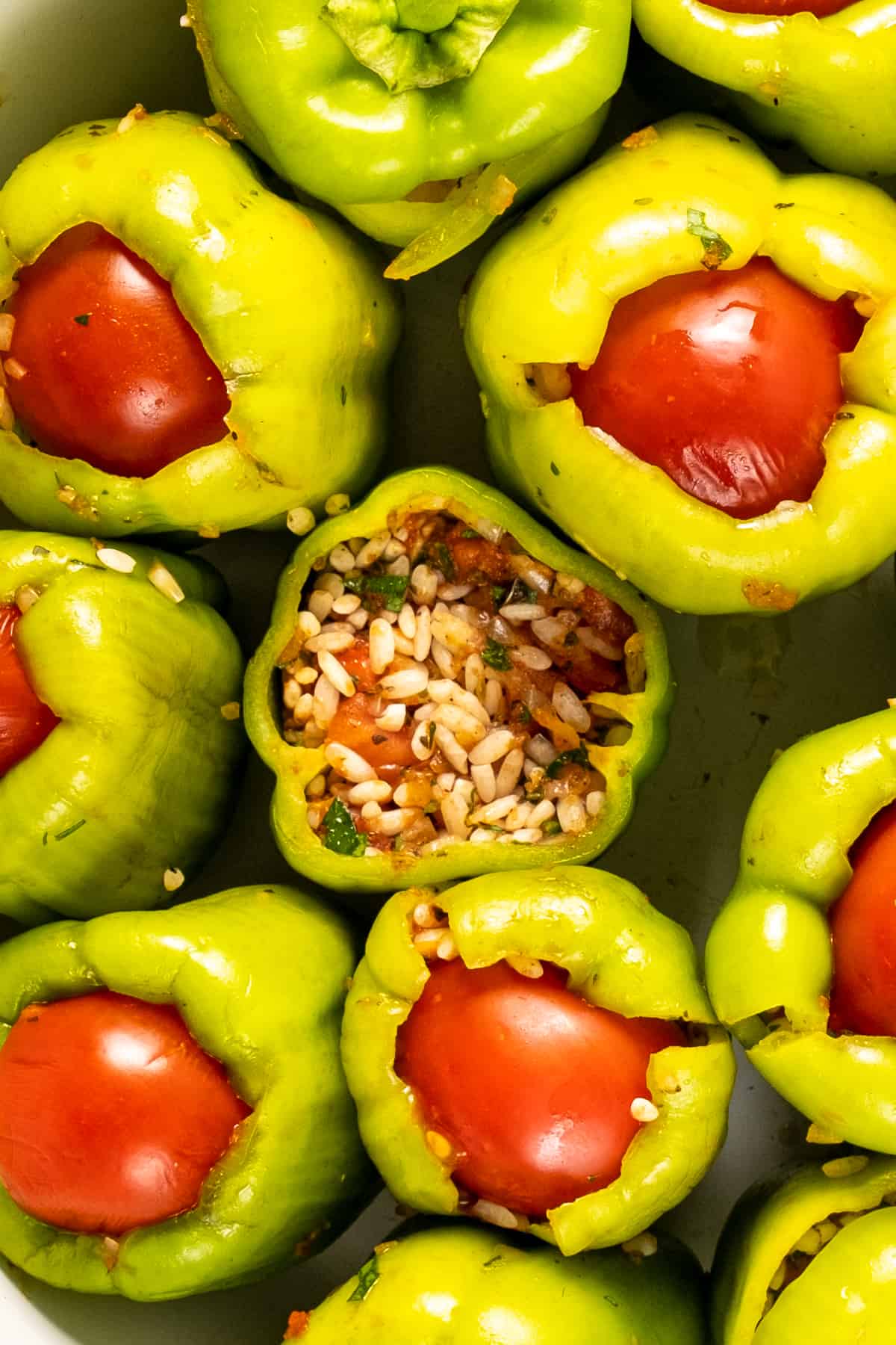 Green peppers stuffed with rice and topped with tomatoes.