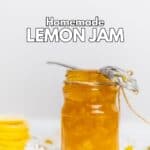 Lemon jam in a jar and a spoon on it.