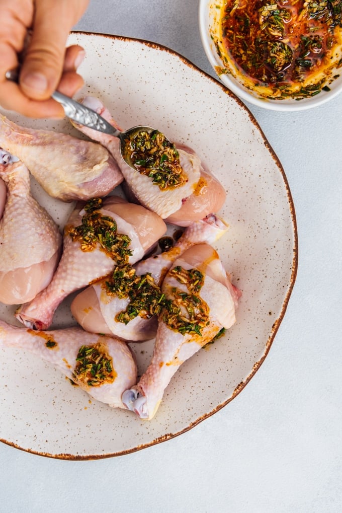 These are the best oven baked chicken legs! No need to wait for the marinade. Yummy, juicy and easy to make. #chickenrecipe #bakedchicken #chickenlegs #chickendrumsticks How to cook chicken legs in oven with herbs image
