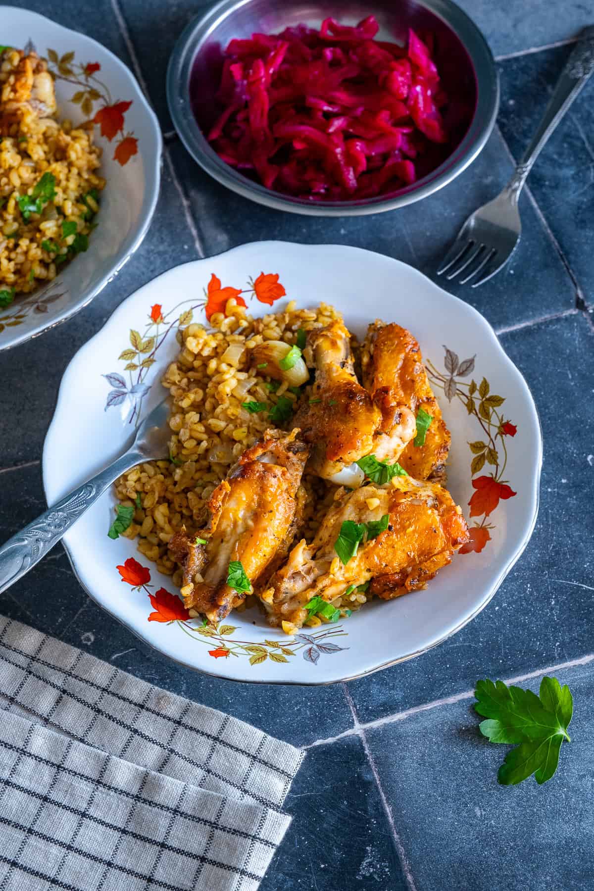 Chicken wings with bulgur and garlic served with Turkish pickled red cabbage.