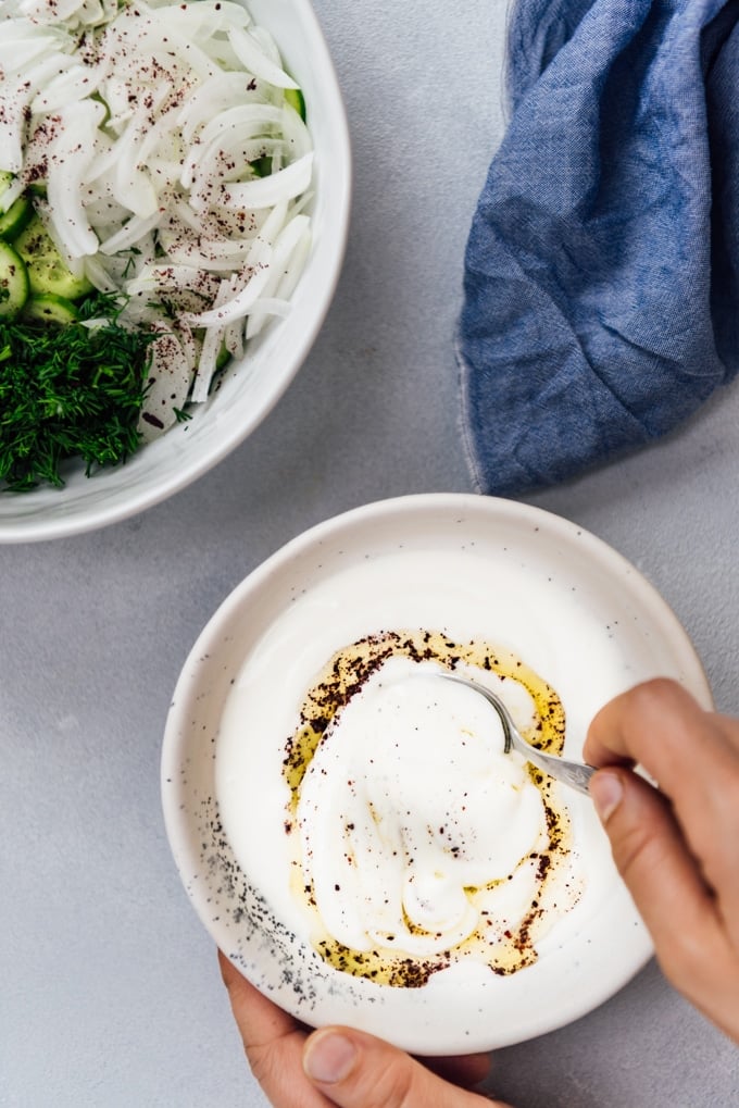 Creamy cucumber salad dressing with Greek yogurt, olive oil and sumac