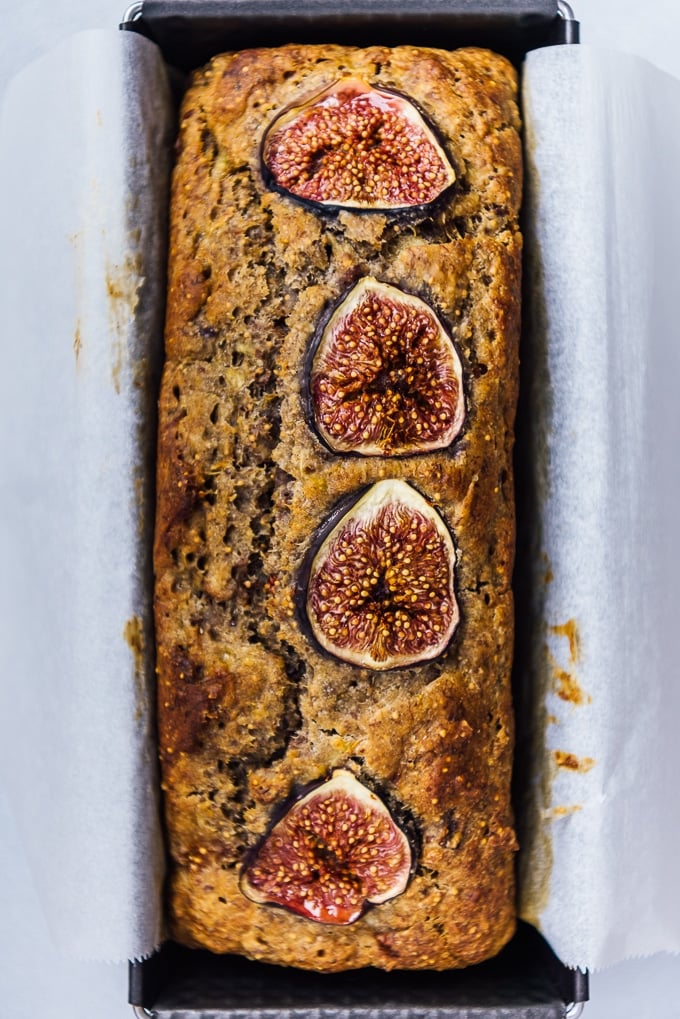 Easy banana fig bread topped with fresh fig slices in a loaf pan.