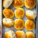 Baked rolls in a baking tray.