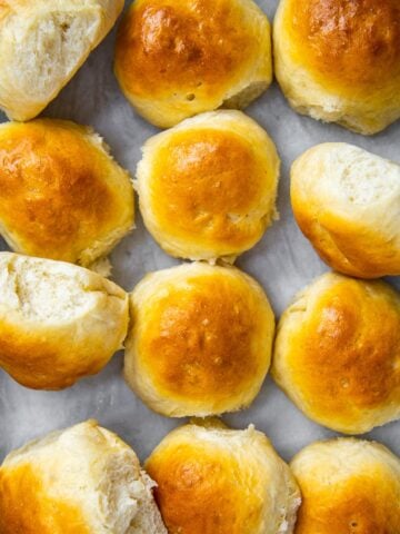Baked rolls in a baking tray.
