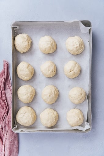 ball shaped dinner rolls in a baking pan