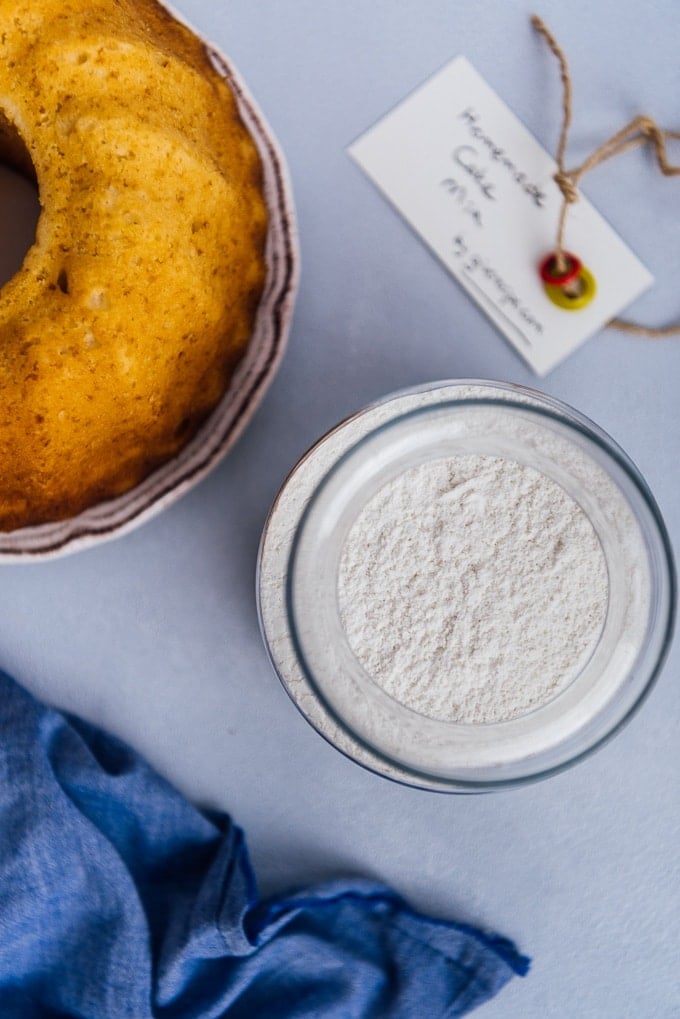 Homemade cake mix in a jar and a bundt cake on the side.