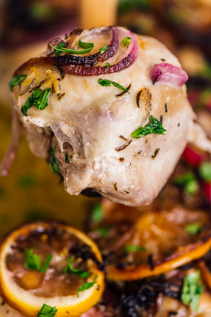 Easy Baked Lemon Chicken Thighs. Healthy and perfect meal for special occasions! #chickenrecipe #bakedchicken #healthychicken #roastedchicken serving baked lemon garlic chicken thighs
