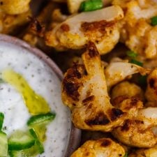 Baked cauliflower wings served with a yogurt sauce