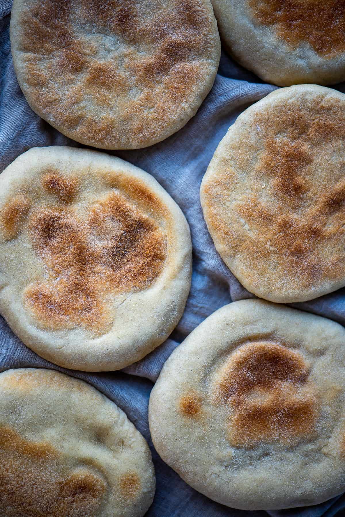Turkish flat breads with brown spots on their top.