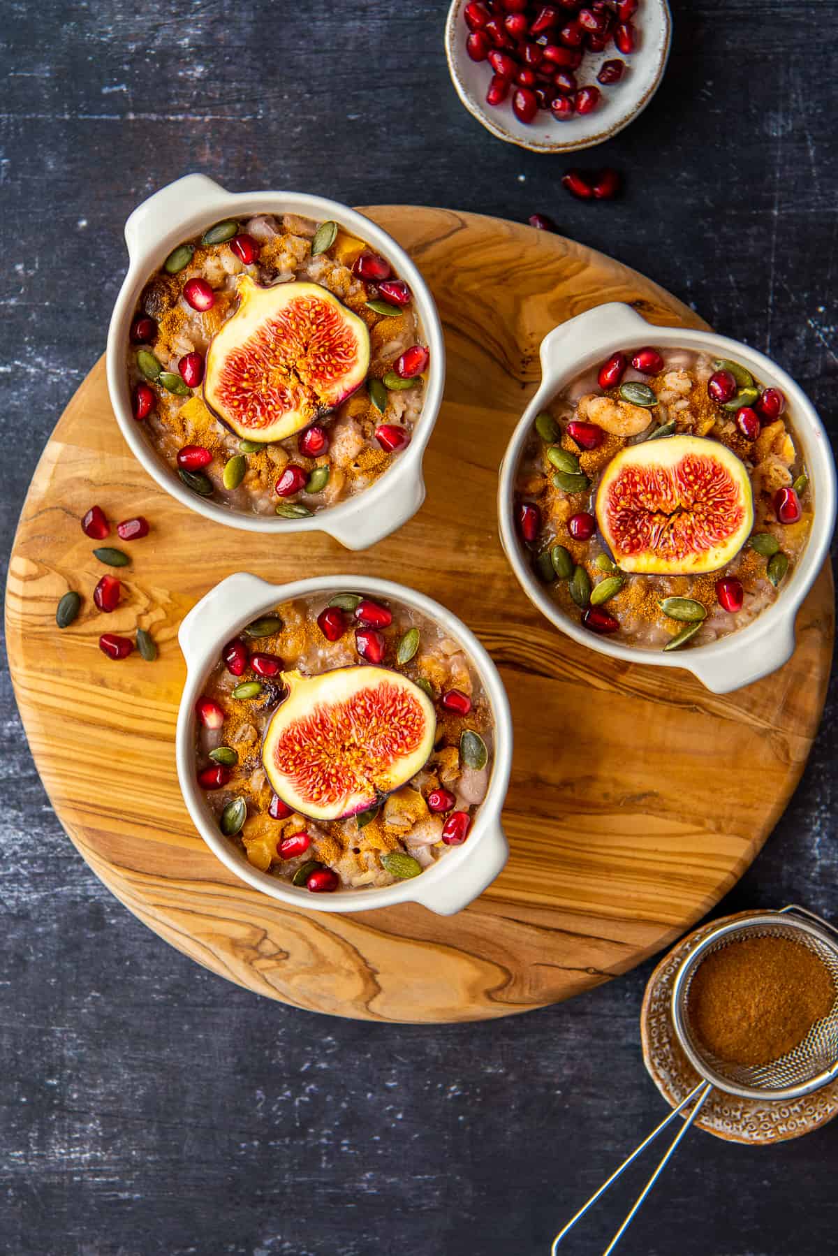 Ashure pudding in three white bowls.