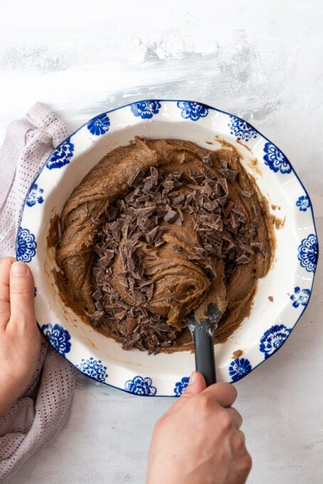 folding chopped chocolate in coffee cookie dough