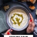 Pinterest image showing a bowl of Turkish Yogurt Soup (Yayla Çorbası) with butter-mint sauce, held in hands, labeled “Yayla Corbasi – Turkish Yogurt Soup” from giverecipe.com.