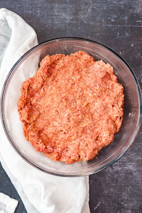 Ground beef mixture in a glass bowl.