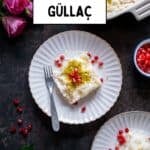 Pinterest image of Turkish Güllaç dessert served on two white scalloped plates, garnished with ground pistachios and pomegranate seeds, with a baking dish of the dessert and pink roses in the background.