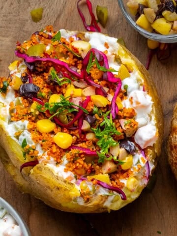 Turkish kumpir (baked potatoes) topped with salads.