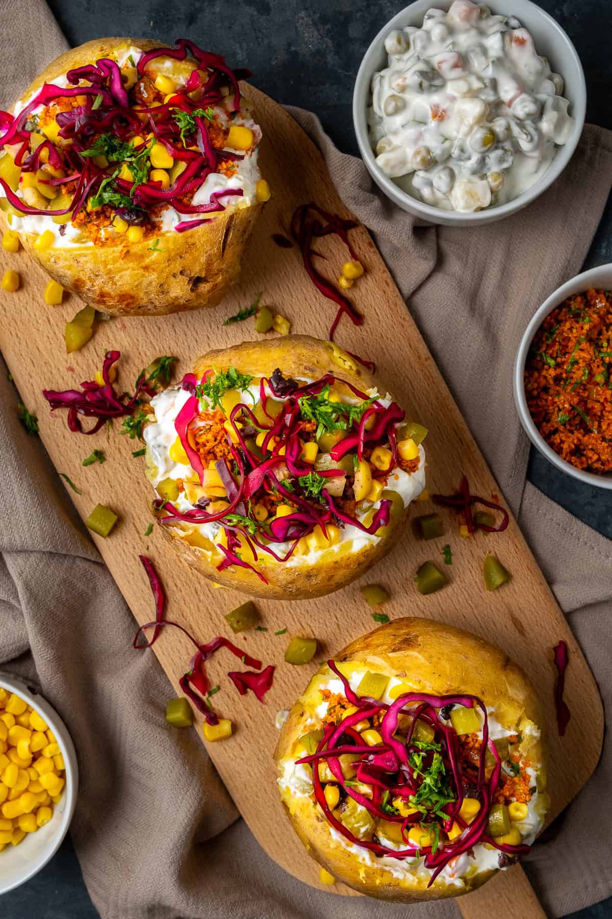 Turkish baked potatoes stuffed with a variety of salads, sweet corn, olives and pickles.