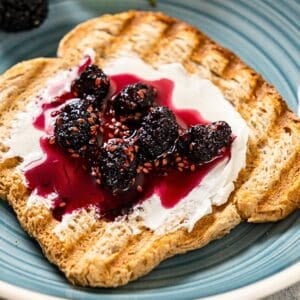 Mulberry jam on a slice of toasted bread.