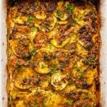 Zucchini casserole with a golden brown topping.