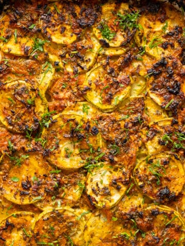 Zucchini casserole with a golden brown topping.