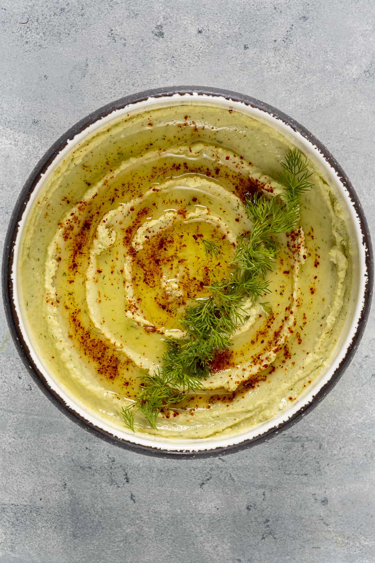 Fava bean dip in a white bowl.