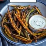 Crispy whole okra cooked in an air fryer, served in a bowl with dipping sauce.
