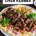 Chunks of grilled Turkish liver kebab served on lavash bread with sumac onion salad and fresh parsley.